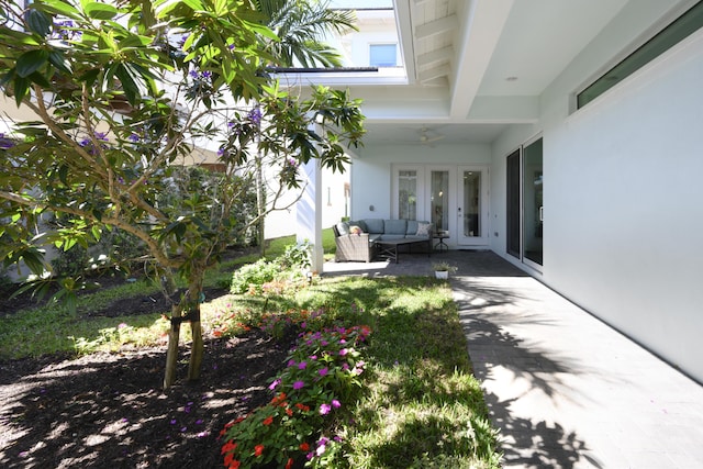 view of patio / terrace with a ceiling fan, french doors, and outdoor lounge area