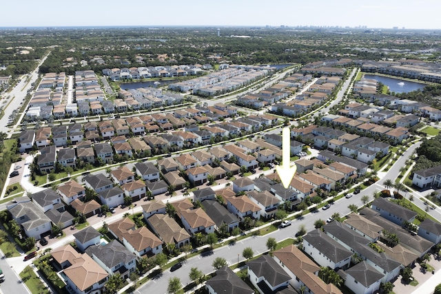 aerial view featuring a residential view and a water view