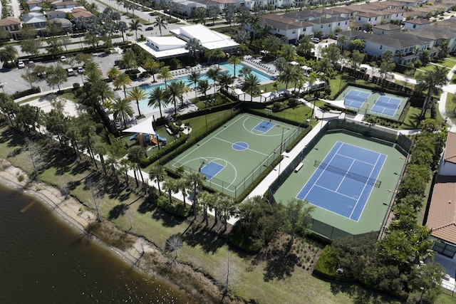 birds eye view of property featuring a water view and a residential view