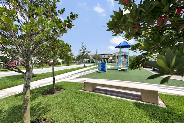 community play area with a lawn