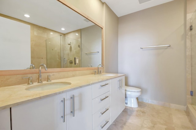 full bath featuring a sink, a shower stall, and double vanity