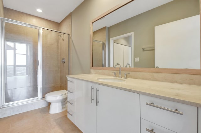 full bathroom with recessed lighting, toilet, vanity, a shower stall, and tile patterned flooring