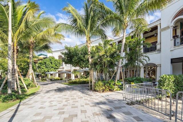 view of road featuring decorative driveway