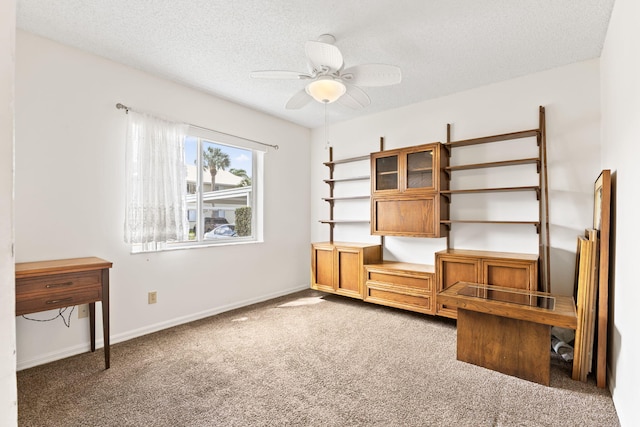 218 SE Village Dr Unit 218, Port Saint Lucie, FL 34952 - unfurnished room featuring carpet flooring, ceiling fan, a textured ceiling, and baseboards