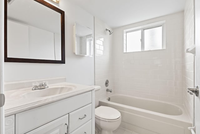 218 SE Village Dr Unit 218, Port Saint Lucie, FL 34952 - bathroom with vanity, toilet,  shower combination, and tile patterned flooring