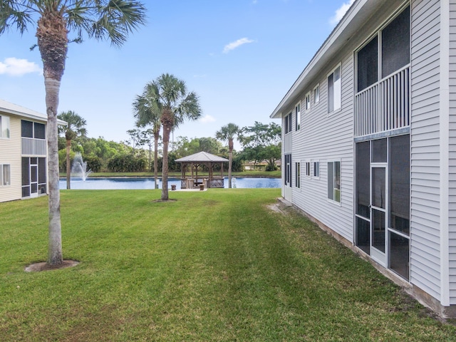 218 SE Village Dr Unit 218, Port Saint Lucie, FL 34952 - view of grassy yard with a gazebo and a water view