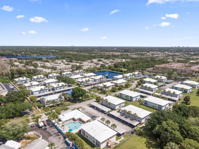 218 SE Village Dr Unit 218, Port Saint Lucie, FL 34952 - aerial perspective of suburban area featuring a pool area and a nearby body of water