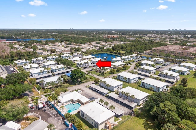 218 SE Village Dr Unit 218, Port Saint Lucie, FL 34952 - aerial overview of property's location featuring a pool, nearby suburban area, and a nearby body of water