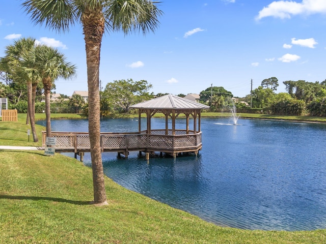 218 SE Village Dr Unit 218, Port Saint Lucie, FL 34952 - dock area featuring a lawn, a gazebo, and a water view