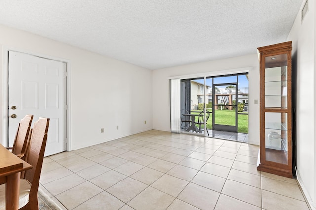 218 SE Village Dr Unit 218, Port Saint Lucie, FL 34952 - empty room with a textured ceiling and light tile patterned floors