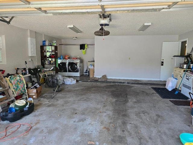 garage with washer and clothes dryer