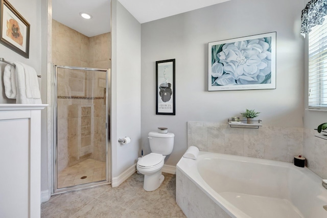 full bath with a garden tub, toilet, a stall shower, tile patterned flooring, and baseboards