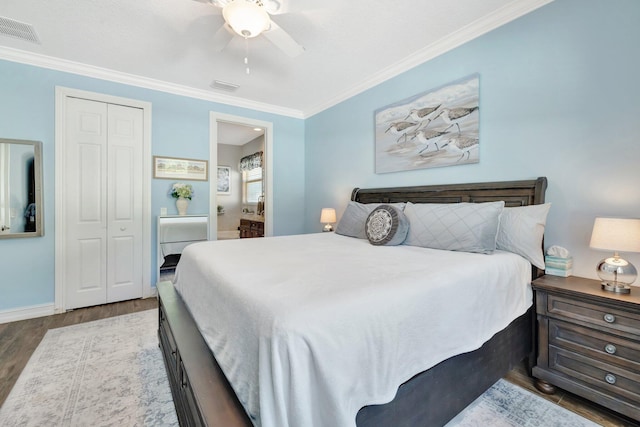 bedroom featuring visible vents, wood finished floors, and ornamental molding