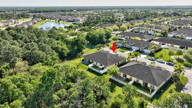 birds eye view of property with a residential view and a water view