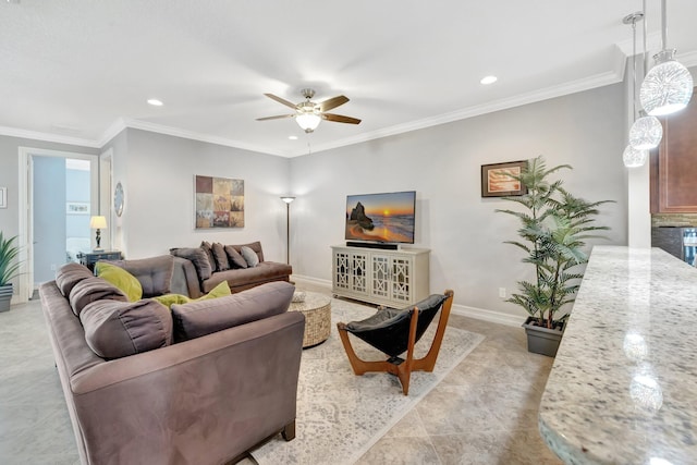 living area with recessed lighting, baseboards, ceiling fan, and crown molding