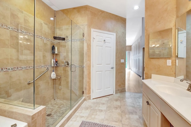 full bath with recessed lighting, a stall shower, tile patterned floors, and vanity