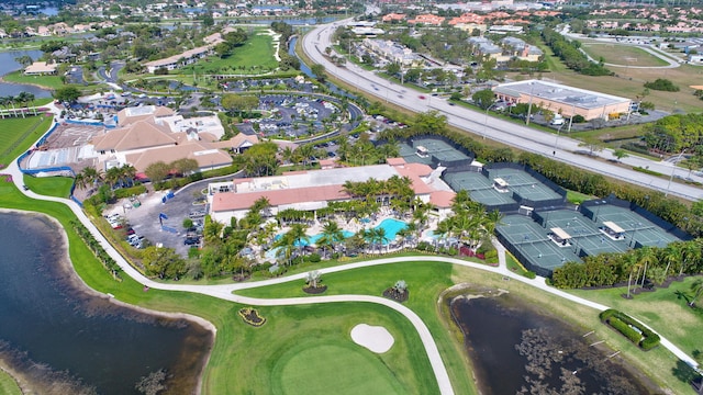 bird's eye view featuring a residential view, view of golf course, and a water view