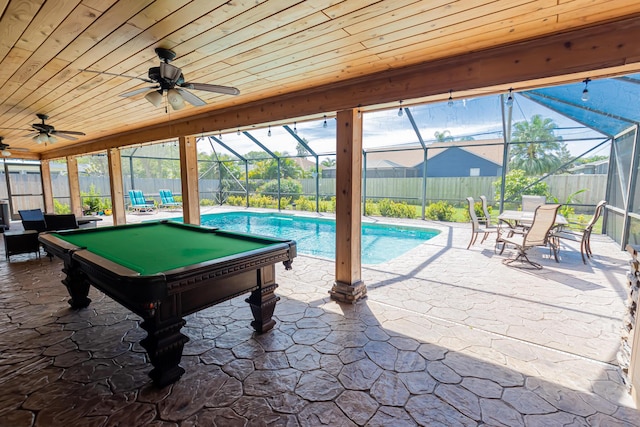 exterior space with ceiling fan, a patio area, a fenced backyard, and a lanai