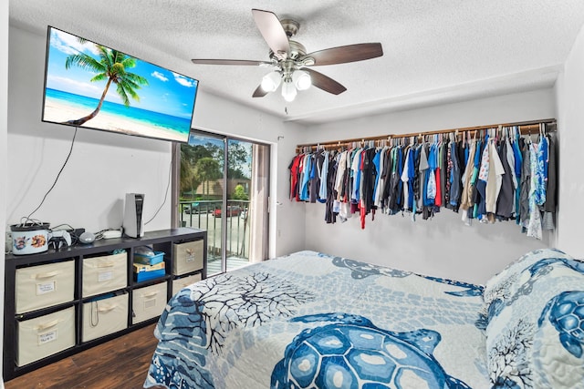 bedroom featuring a textured ceiling, access to outside, ceiling fan, and wood finished floors