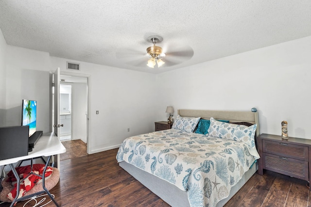 bedroom featuring a textured ceiling, ceiling fan, wood finished floors, and baseboards