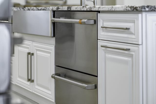 kitchen with white cabinets