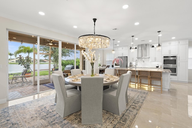 dining space featuring recessed lighting, visible vents, and an inviting chandelier