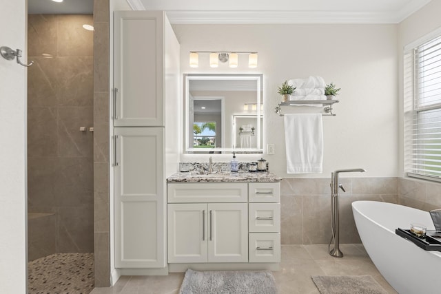 bathroom with vanity, tiled shower, crown molding, and a freestanding tub