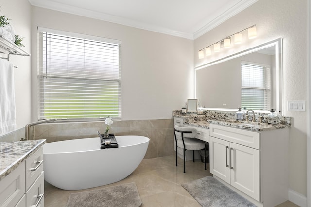 4113 Worlington Ter, Fort Pierce, FL 34947 - bathroom with vanity, ornamental molding, a freestanding tub, tile patterned floors, and tile walls