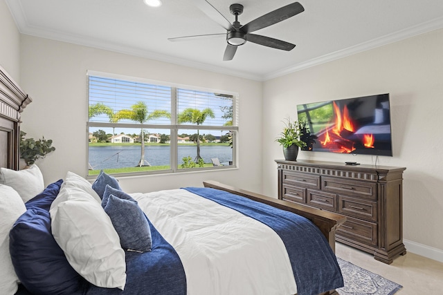 bedroom with a lit fireplace, ceiling fan, baseboards, and ornamental molding