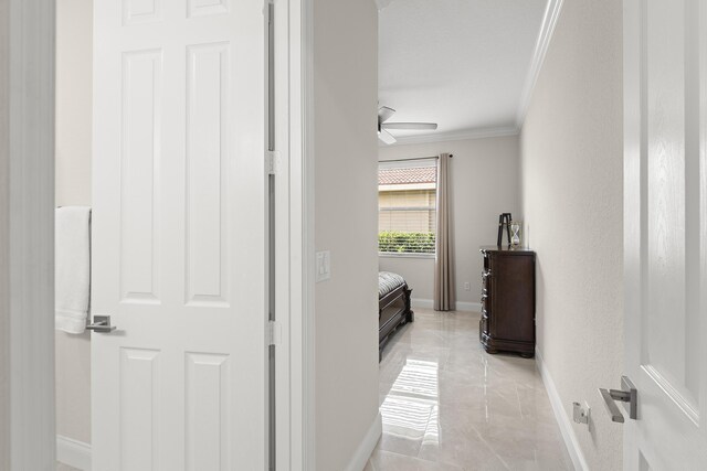 4113 Worlington Ter, Fort Pierce, FL 34947 - corridor featuring crown molding, baseboards, and light marble finish flooring
