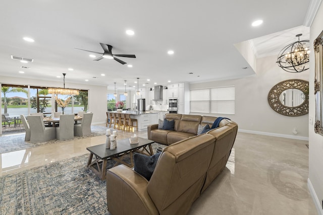 living room featuring visible vents, recessed lighting, baseboards, and ornamental molding