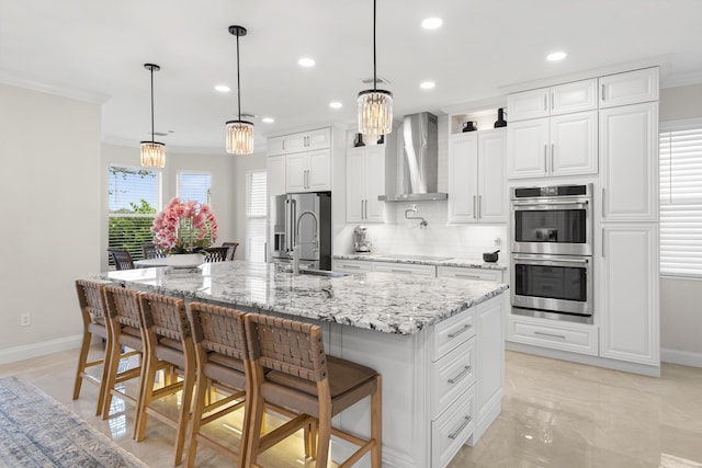 kitchen with stainless steel appliances, crown molding, decorative backsplash, and wall chimney range hood