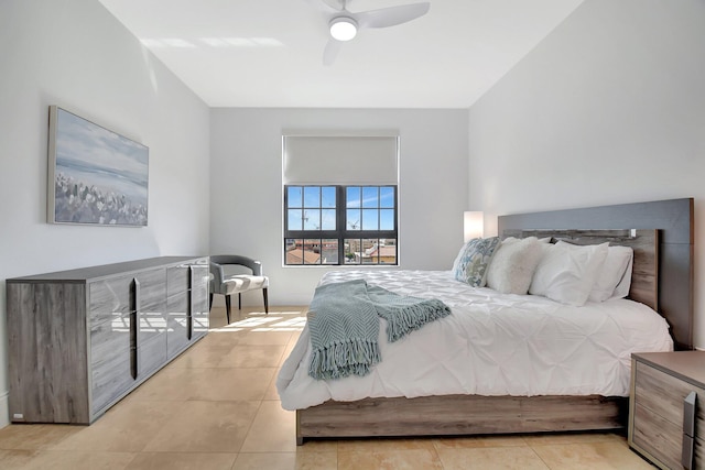 tiled bedroom with ceiling fan