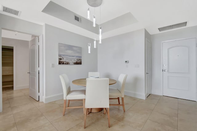 dining area featuring light tile patterned floors and visible vents