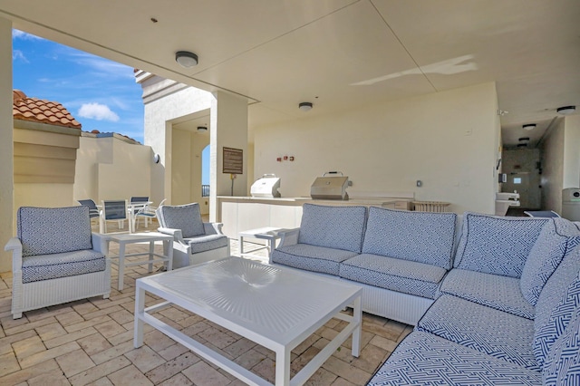 view of patio / terrace with area for grilling and an outdoor living space