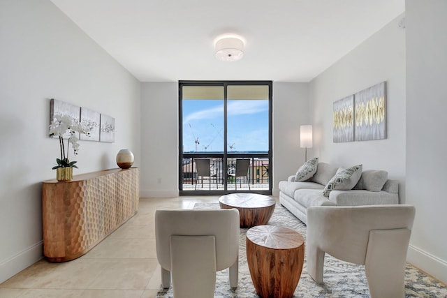 living room with baseboards, floor to ceiling windows, and light tile patterned flooring