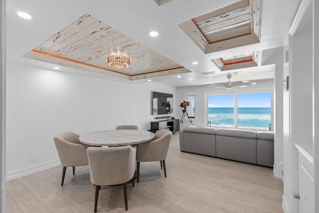 dining space featuring a tray ceiling, wood ceiling, and recessed lighting