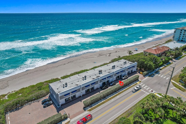 aerial view featuring a water view and a beach view