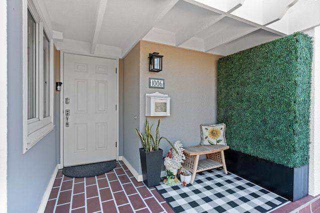 doorway to property with stucco siding