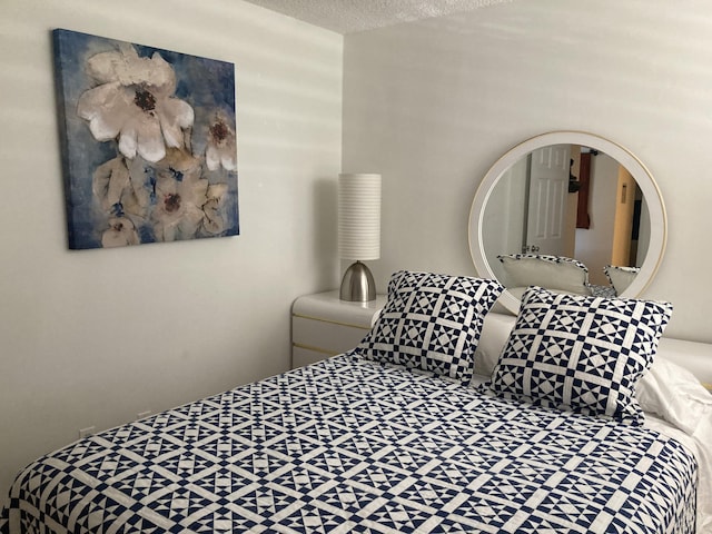 bedroom featuring a textured ceiling