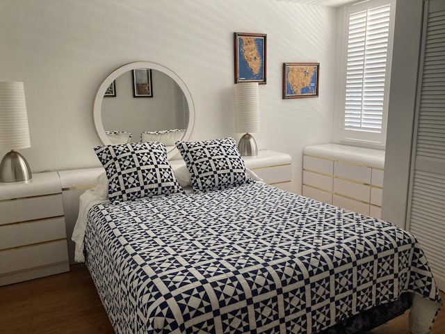 bedroom featuring wood finished floors