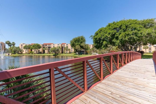 dock area featuring a deck with water view
