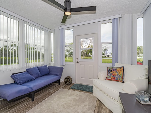 sunroom with a ceiling fan