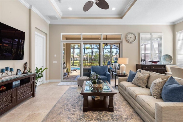 living area with light tile patterned floors, baseboards, visible vents, ceiling fan, and crown molding