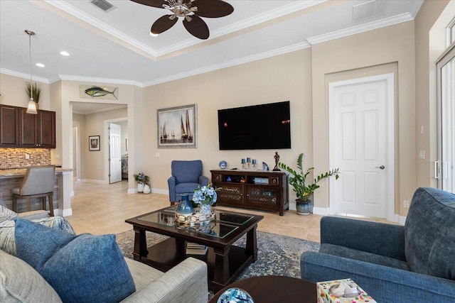 living area with ornamental molding, visible vents, baseboards, and light tile patterned flooring