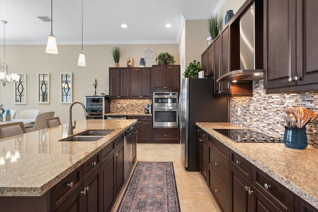 kitchen featuring wall chimney exhaust hood, stainless steel double oven, a sink, dishwashing machine, and black electric cooktop