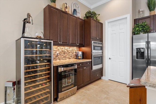 kitchen featuring backsplash, beverage cooler, stainless steel appliances, and crown molding