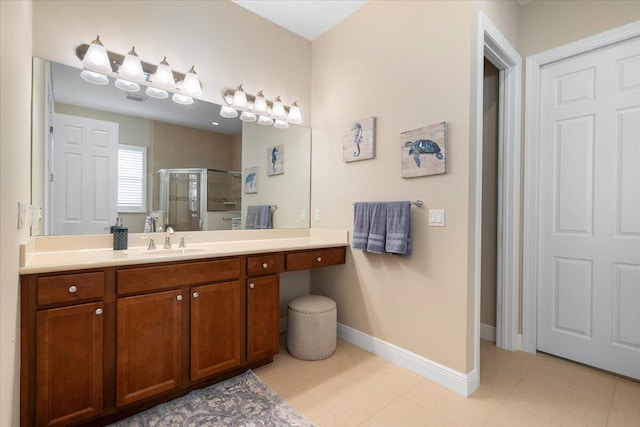 bathroom featuring a shower stall, baseboards, and vanity