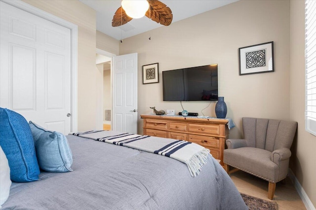 bedroom with baseboards and a ceiling fan