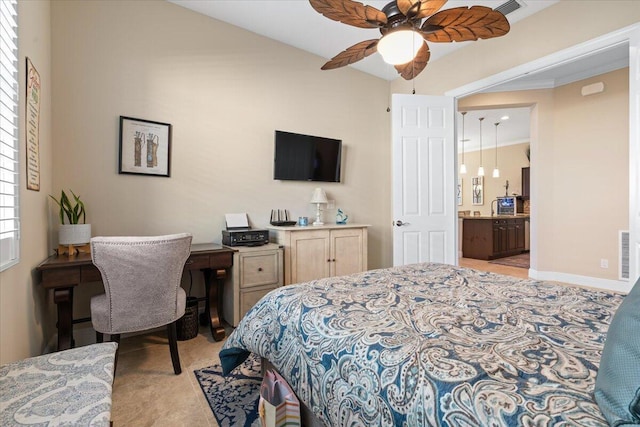 bedroom with a ceiling fan, connected bathroom, visible vents, and baseboards